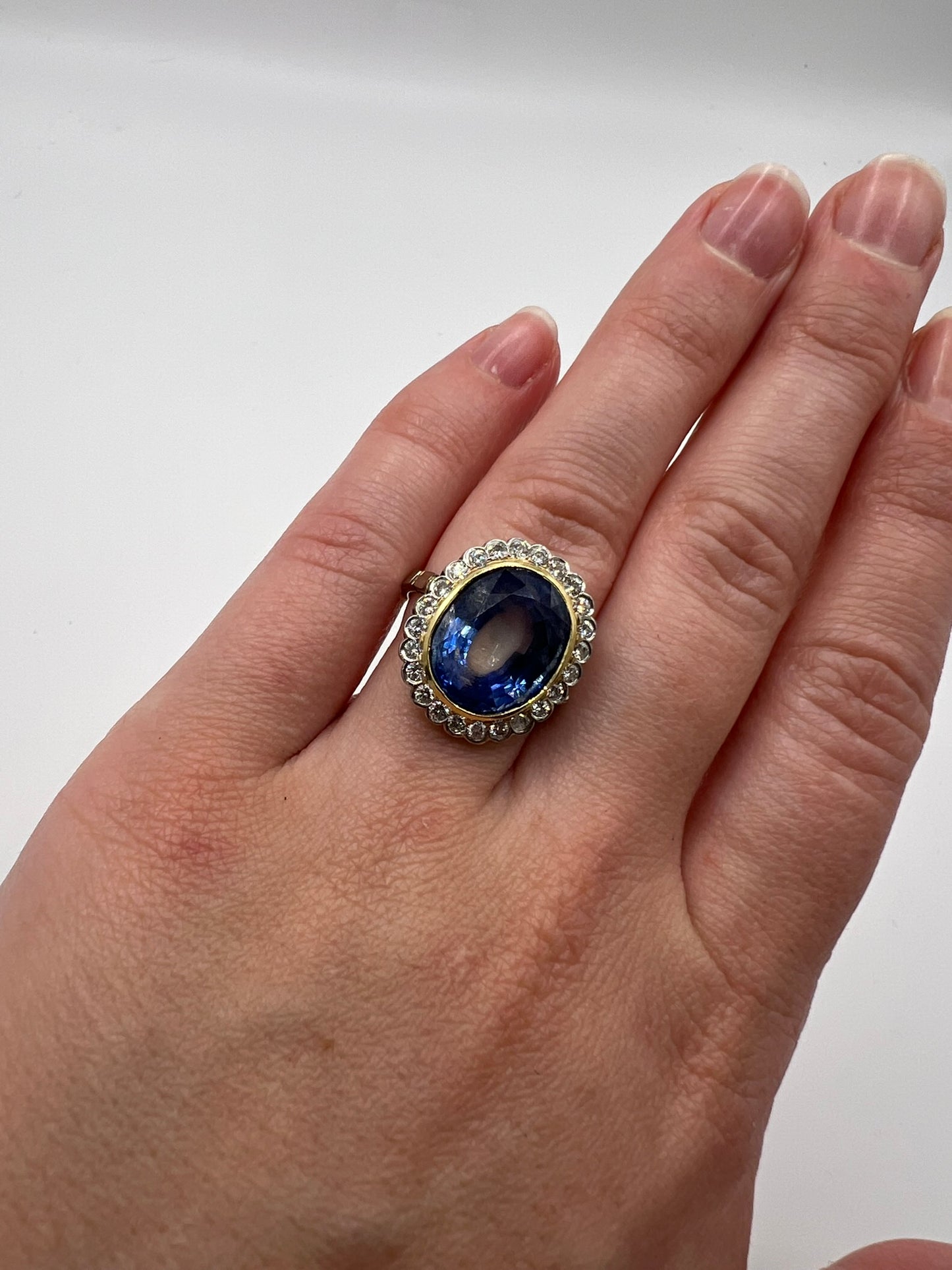 French Cornflower Blue Large 9+ Carat Sapphire Diamond Halo Ring in 18ct White Gold